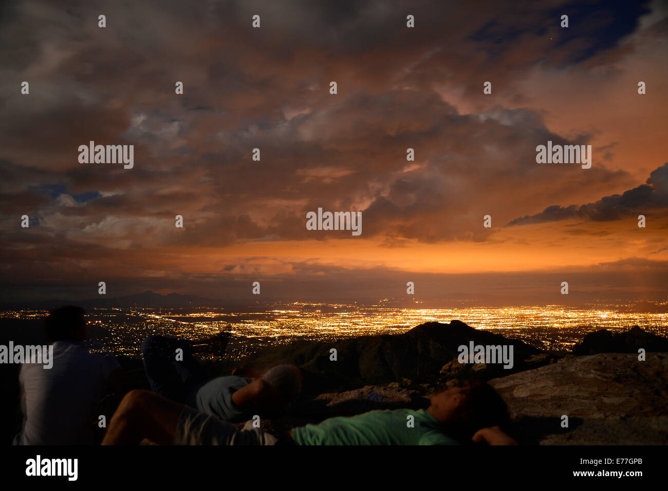 Visitors to Windy Point on Mount Lemmon take in a monsoon sunset and