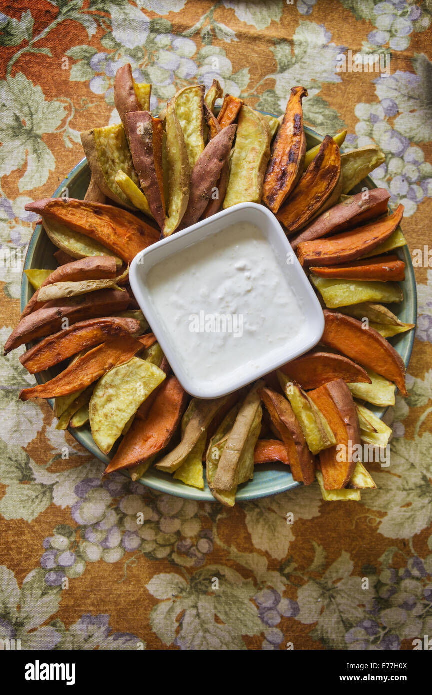 home made roast sweet potato wedges with dip Stock Photo