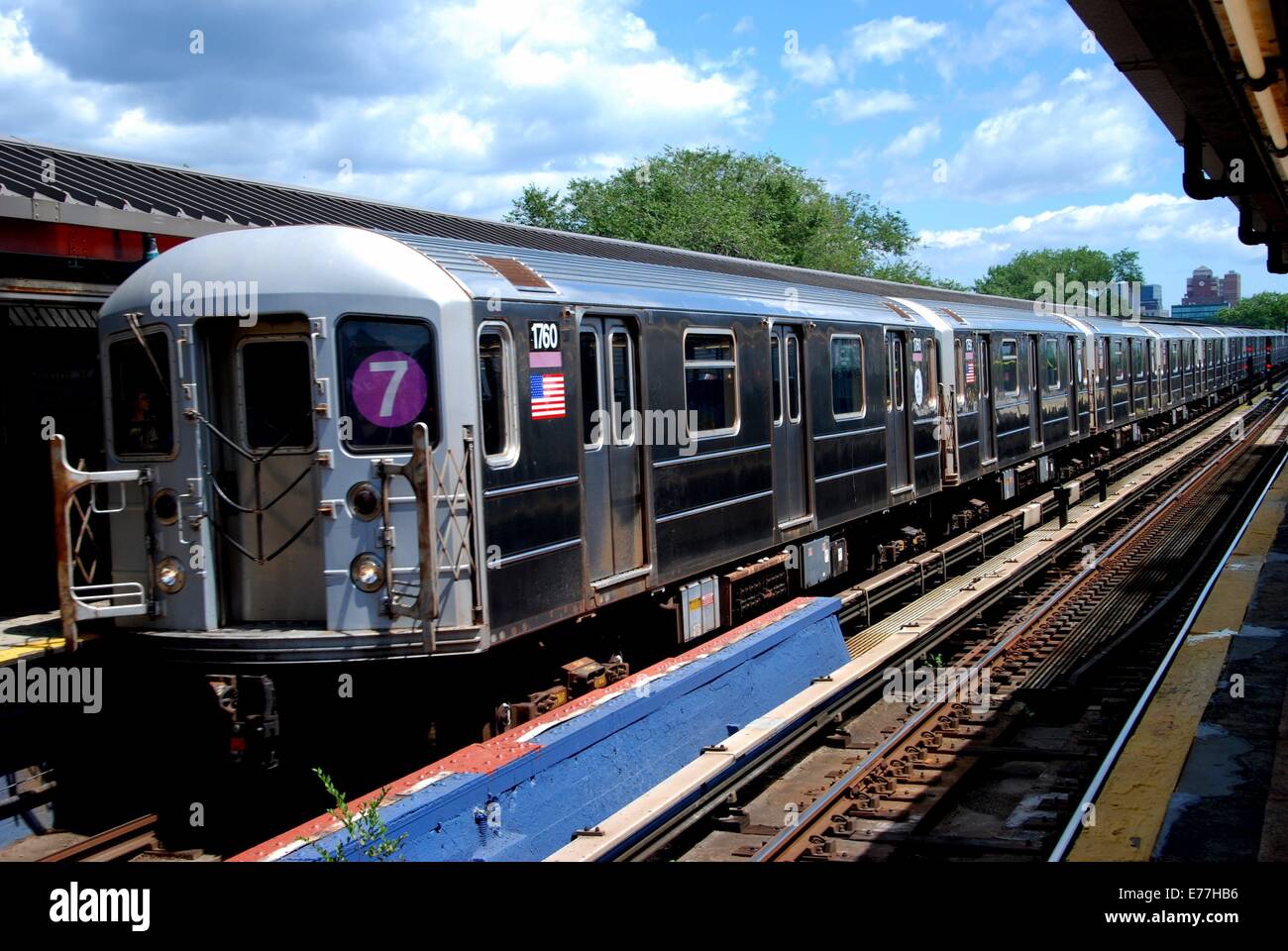 QUEENS, NEW YORK:  A #7 subway train stopped at the Willets Point-Shea Stadium station on the Flushing line Stock Photo