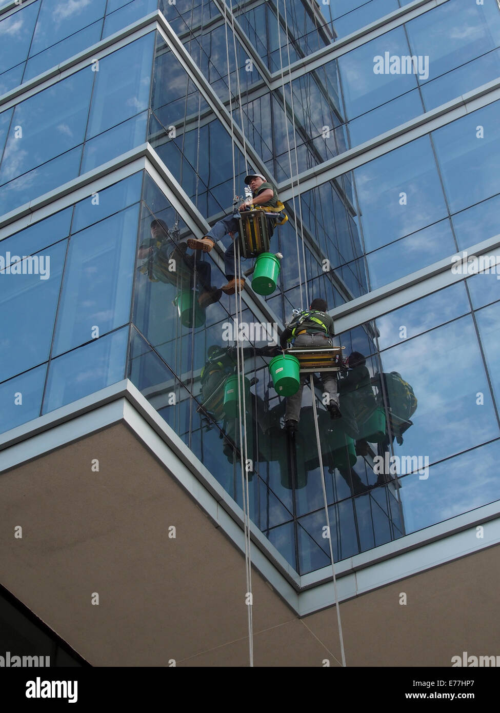 Window washers cleaning The Ritz Carlton's windows in White Plains, New York, USA, September 8, 2014, © Katharine Andriotis Stock Photo