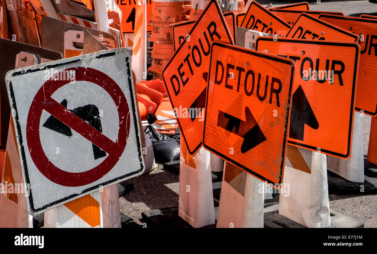 multiple detour and 'no turn' road signs at construction site Stock Photo