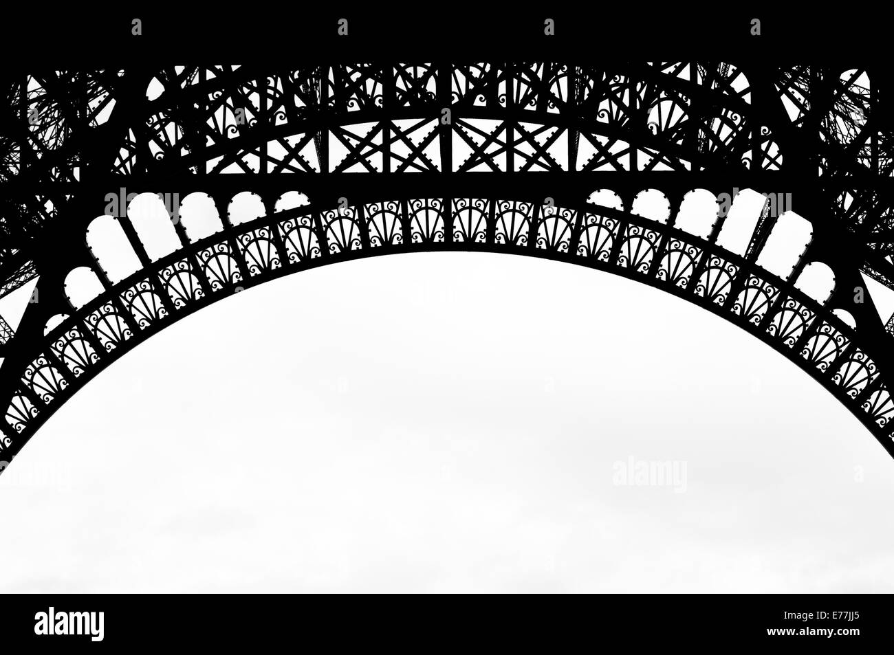A black and white photo of the lattice/iron work of the Eiffel Tower, Paris France. Stock Photo