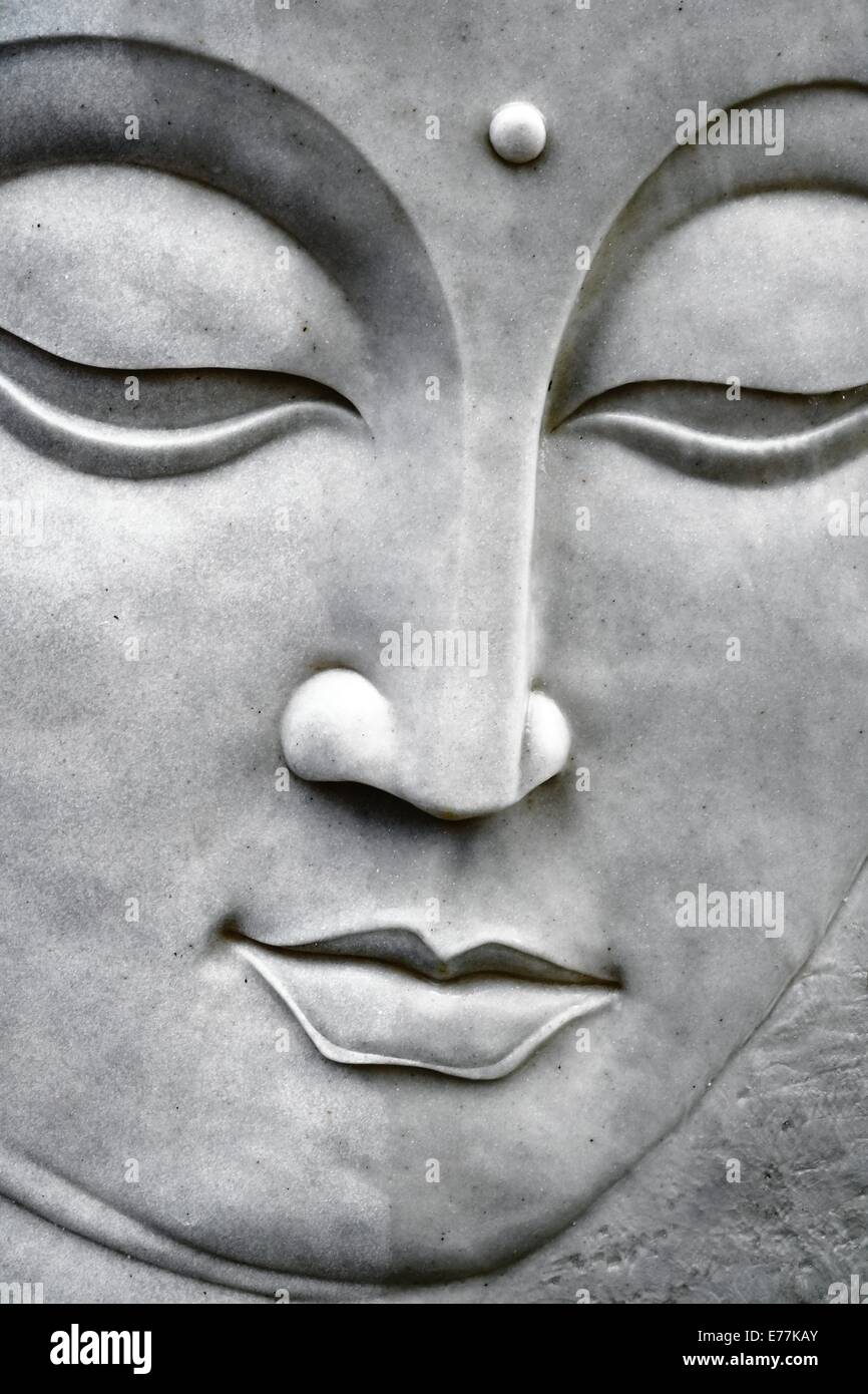 Close up of a buddah buddha stone face Stock Photo
