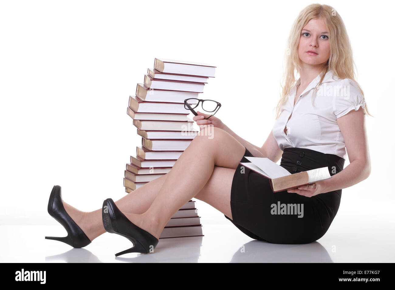 girl with book - Beautiful young woman with books isolated on a white ...