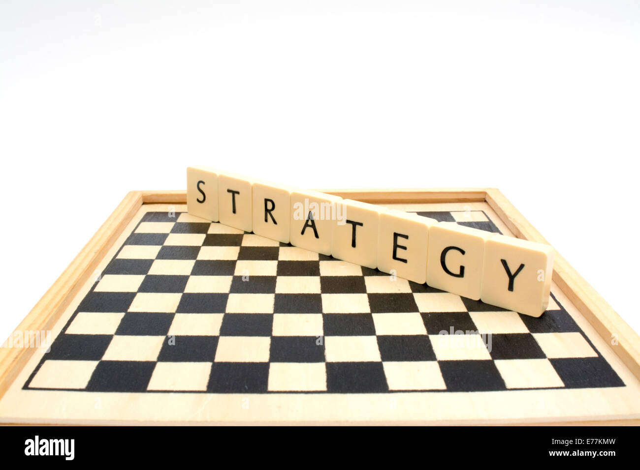 Chess board and strategy word together. Stock Photo