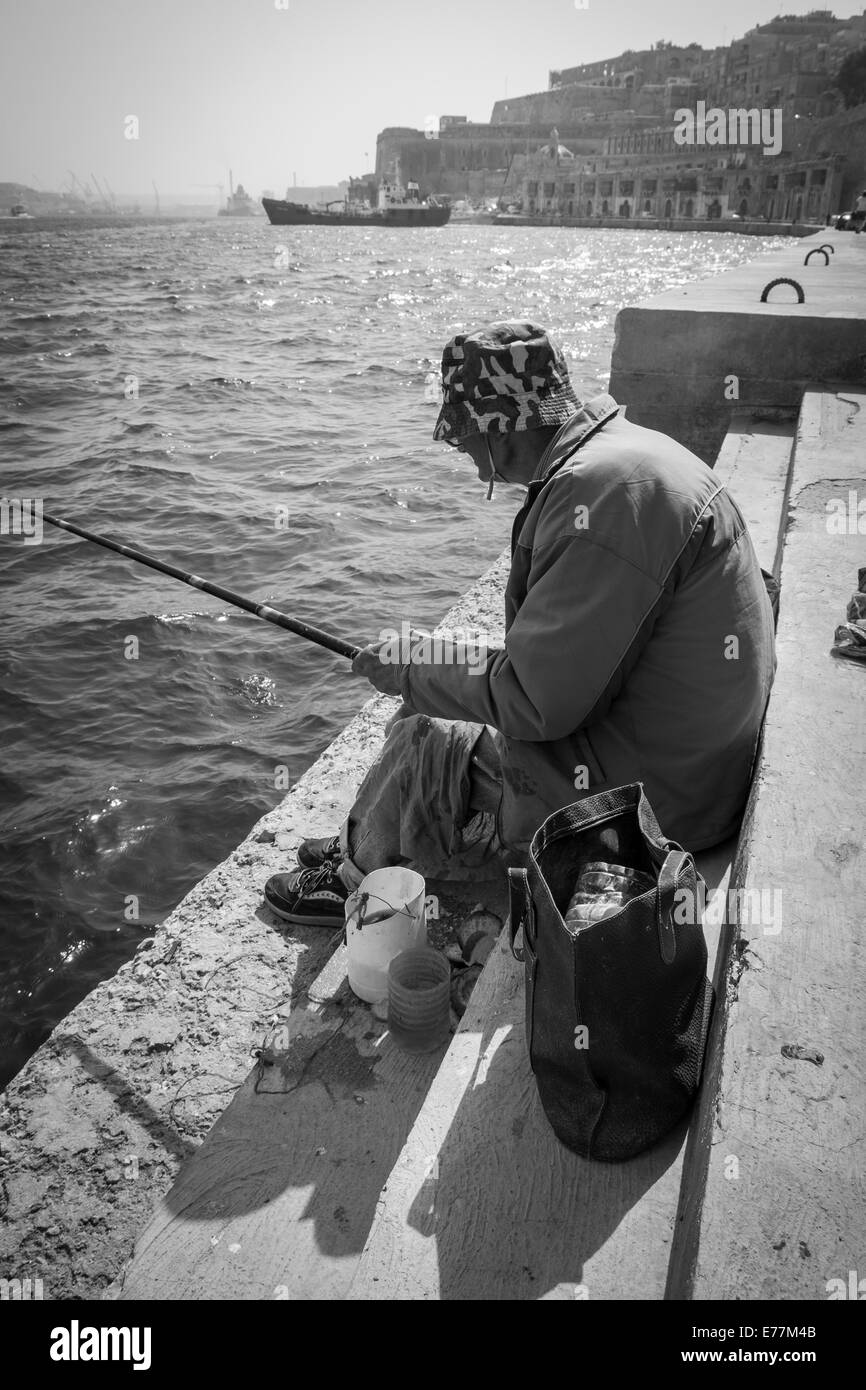 Man Fishing in the Mediterranean Sea Stock Photo