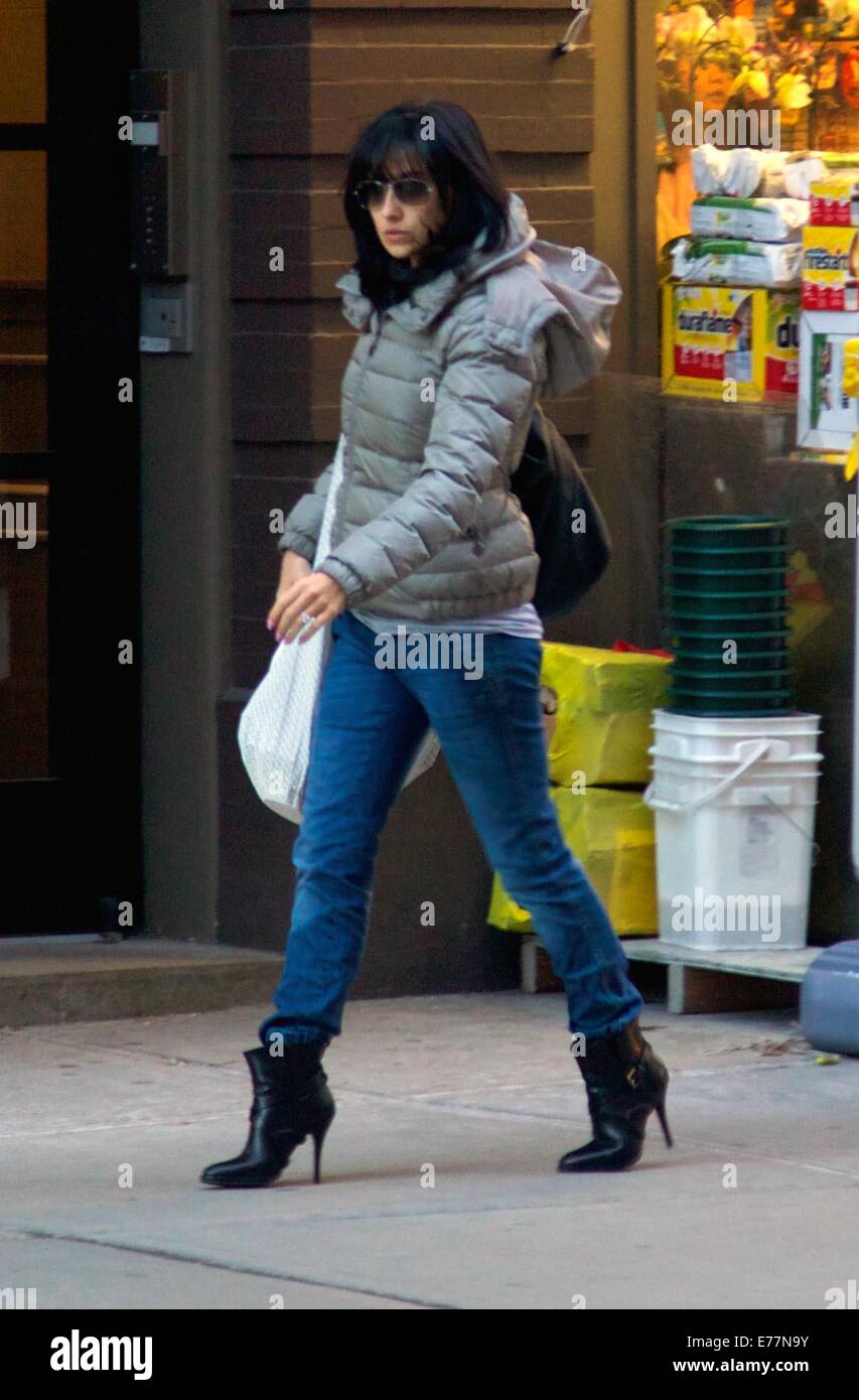 Hilaria Baldwin wrapped up warm in a grey quilted jacket shopping around  the East Village walking in sky high heel boots Featuring: Hilaria Baldwin  Where: New York City, New York, United States