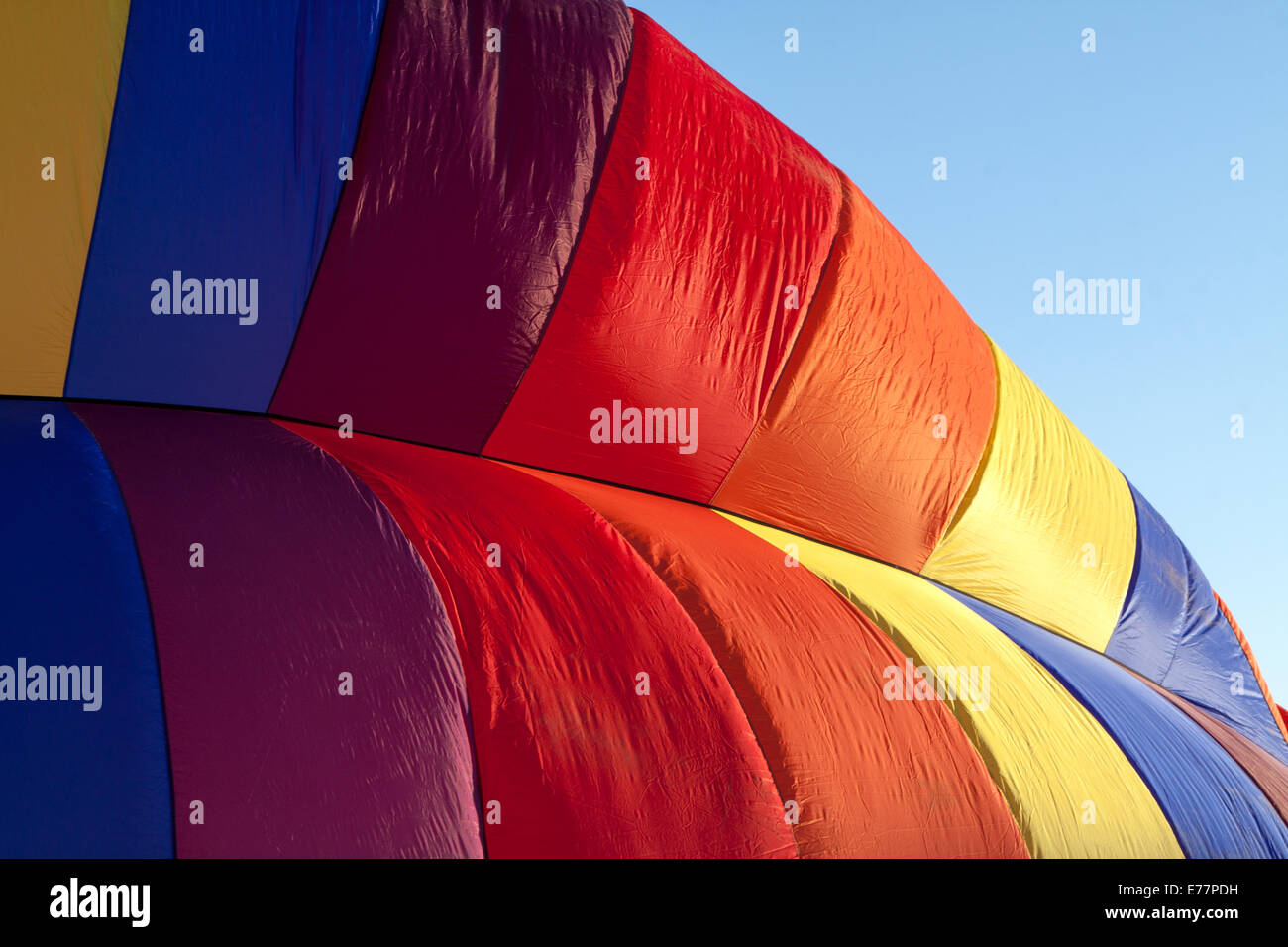 Detail of a hot-air balloon being inflated in early morning light Stock Photo
