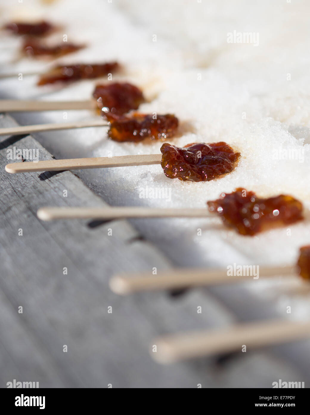 Taffy on snow Maple Taffy Maple taffy on a stick Stock Photo Alamy