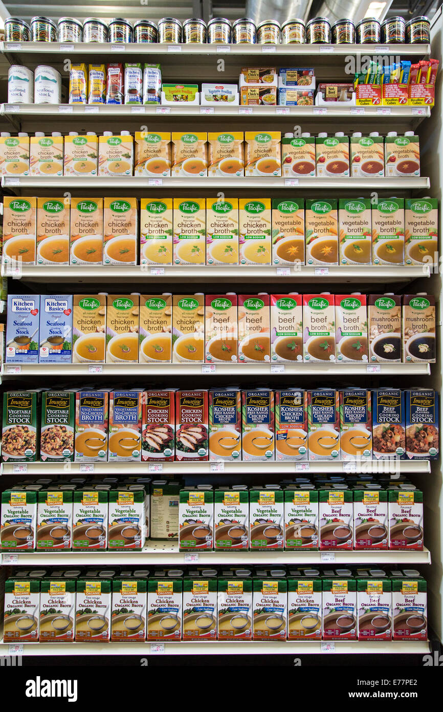A natural foods grocery store aisle with organic broths and stocks. Stock Photo