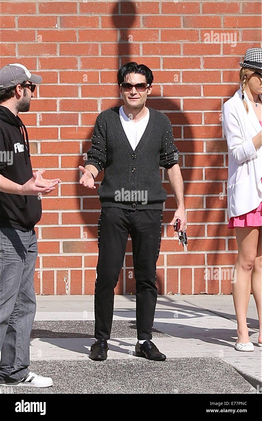 Corey Feldman dressed in the style of Michael Jackson with black shoes,  white socks and a studded cardigan, enjoys a day out with his girlfriend  and friend in Beverly Hills Featuring: Corey