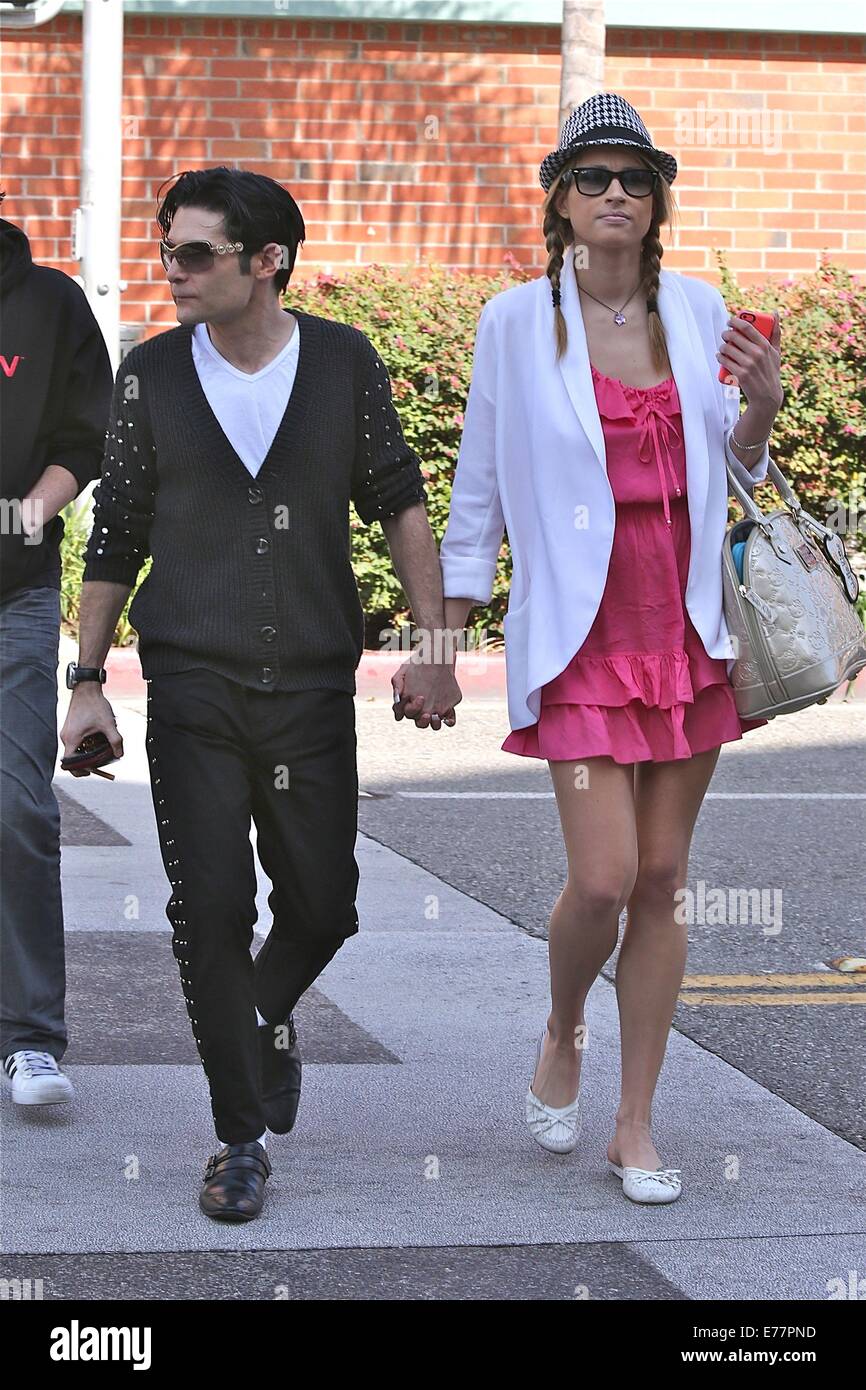 Corey Feldman dressed in the style of Michael Jackson with black shoes, white socks and a studded cardigan, enjoys a day out with his girlfriend and friend in Beverly Hills  Featuring: Corey Feldman Where: Los Angeles, California, United States When: 06 M Stock Photo