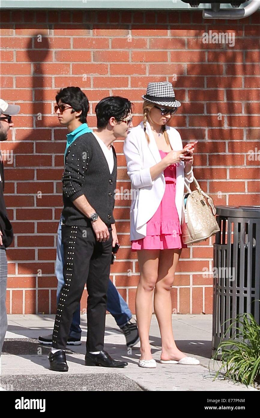 Corey Feldman dressed in the style of Michael Jackson with black shoes