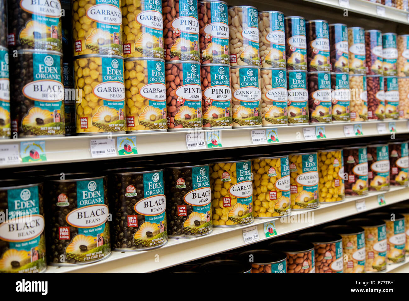 A natural foods grocery store aisle with cans of organic beans. Stock Photo