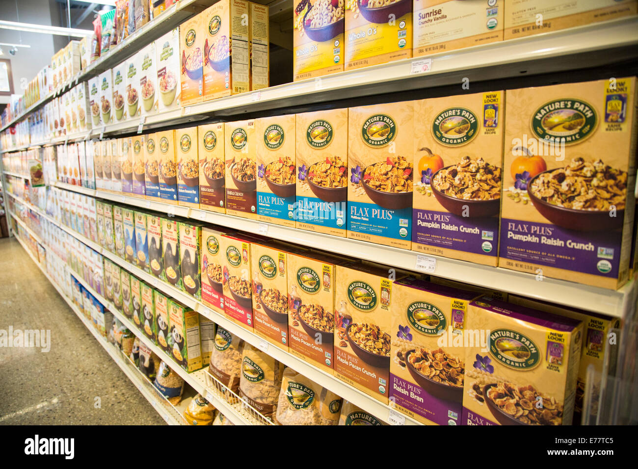 Organic breakfast cereal boxes on the shelves of a natural foods grocery store. Stock Photo