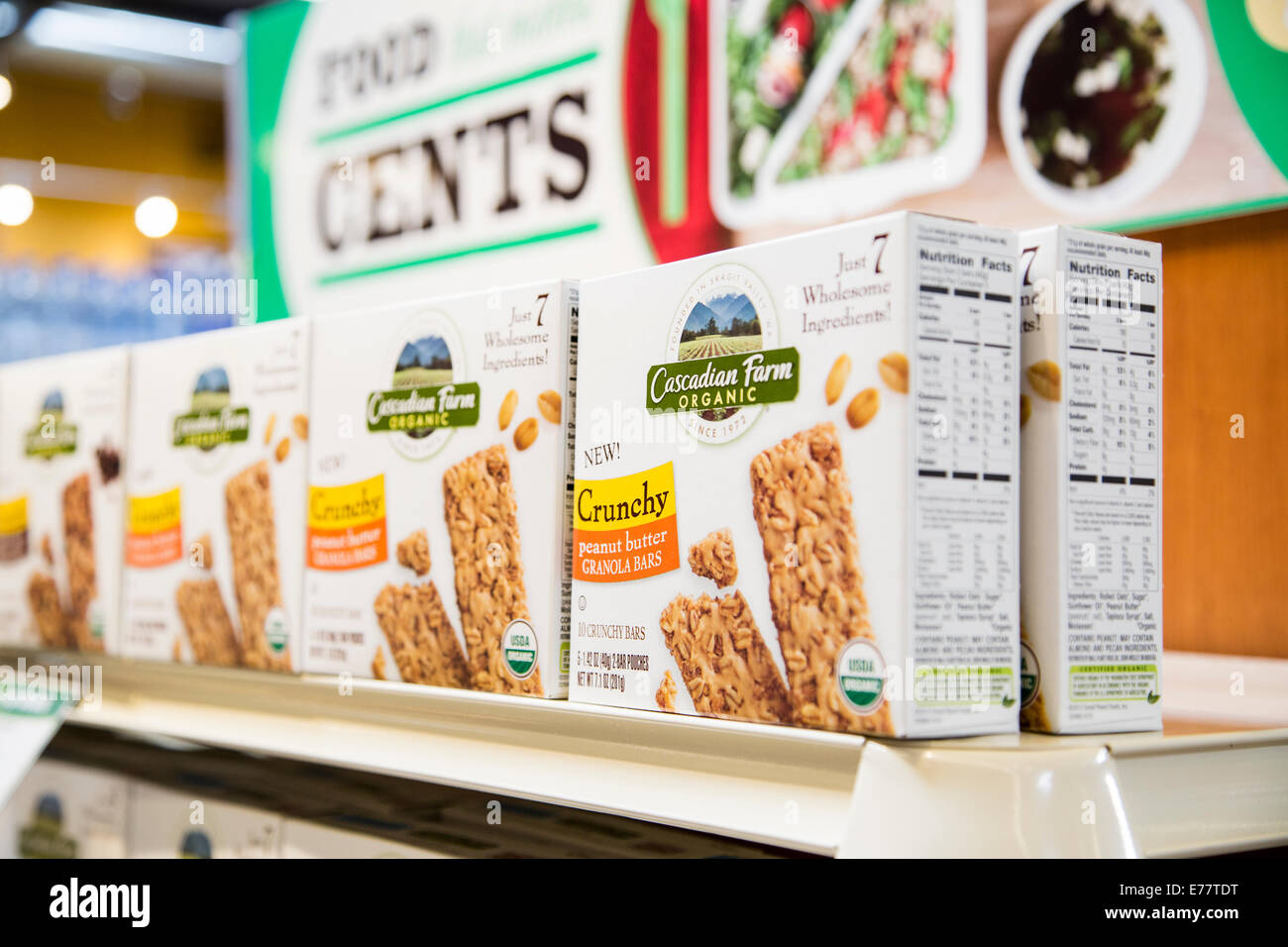 A natural foods grocery store aisle with a shelf of organic granola bars. Stock Photo