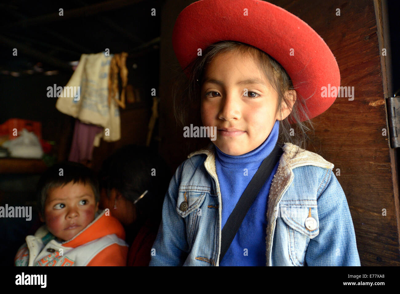 Girl wearing a red hat, La Pajuela, Cajamarca, Cajamarca region, Peru Stock Photo