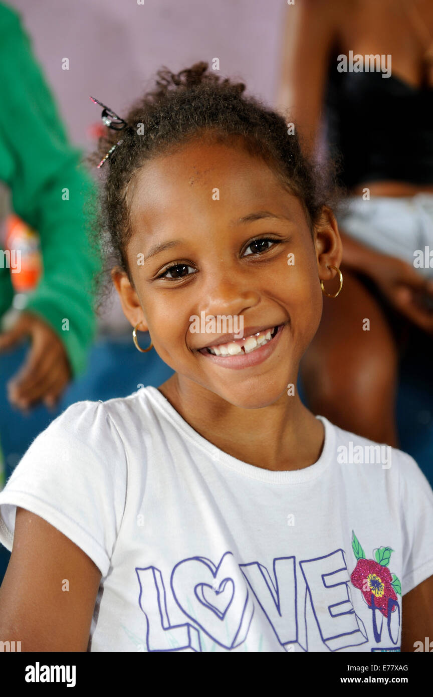 Smiling girl, 11 years, wearing a T-shirt, lettering 'Love', in the slums, Favela Cerro Corá, Rio de Janeiro, Brazil Stock Photo