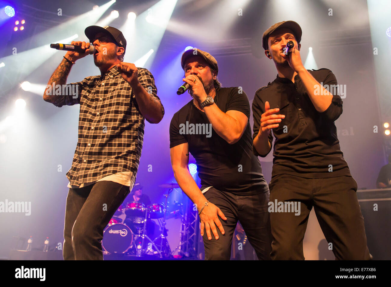 Singers of the German band 'Söhne Mannheims', Tino Oac, Henning Wehland and Michael Klimas, from left, performing live at the Stock Photo