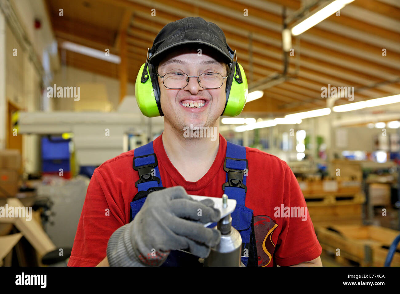 Man with Down syndrome at work Stock Photo
