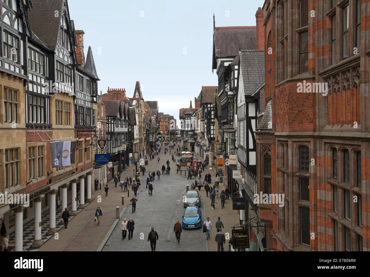 View of extensive pedestrian shopping mall and historic buildings in English city of Chester from Eastgate bridge Stock Photo