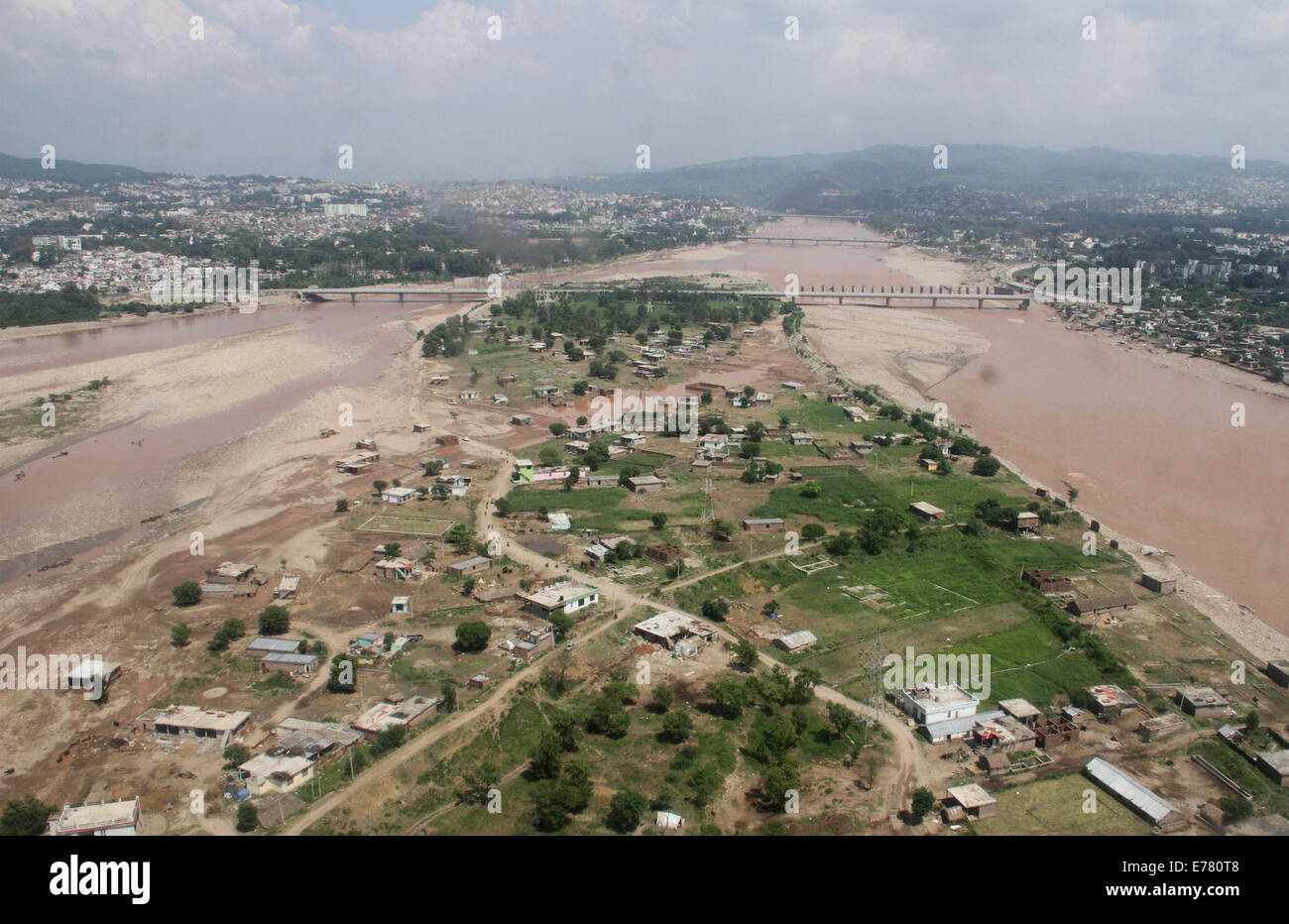 Jammu. 8th Sep, 2014. Photo taken on Sept. 8, 2014 shows an aerial view of the flood-hit area and a badly damaged bridge across the Tawi River in Jammu, India. At least 160 people have been killed in flood related incidents, according to official accounts. © Stringer/Xinhua/Alamy Live News Stock Photo