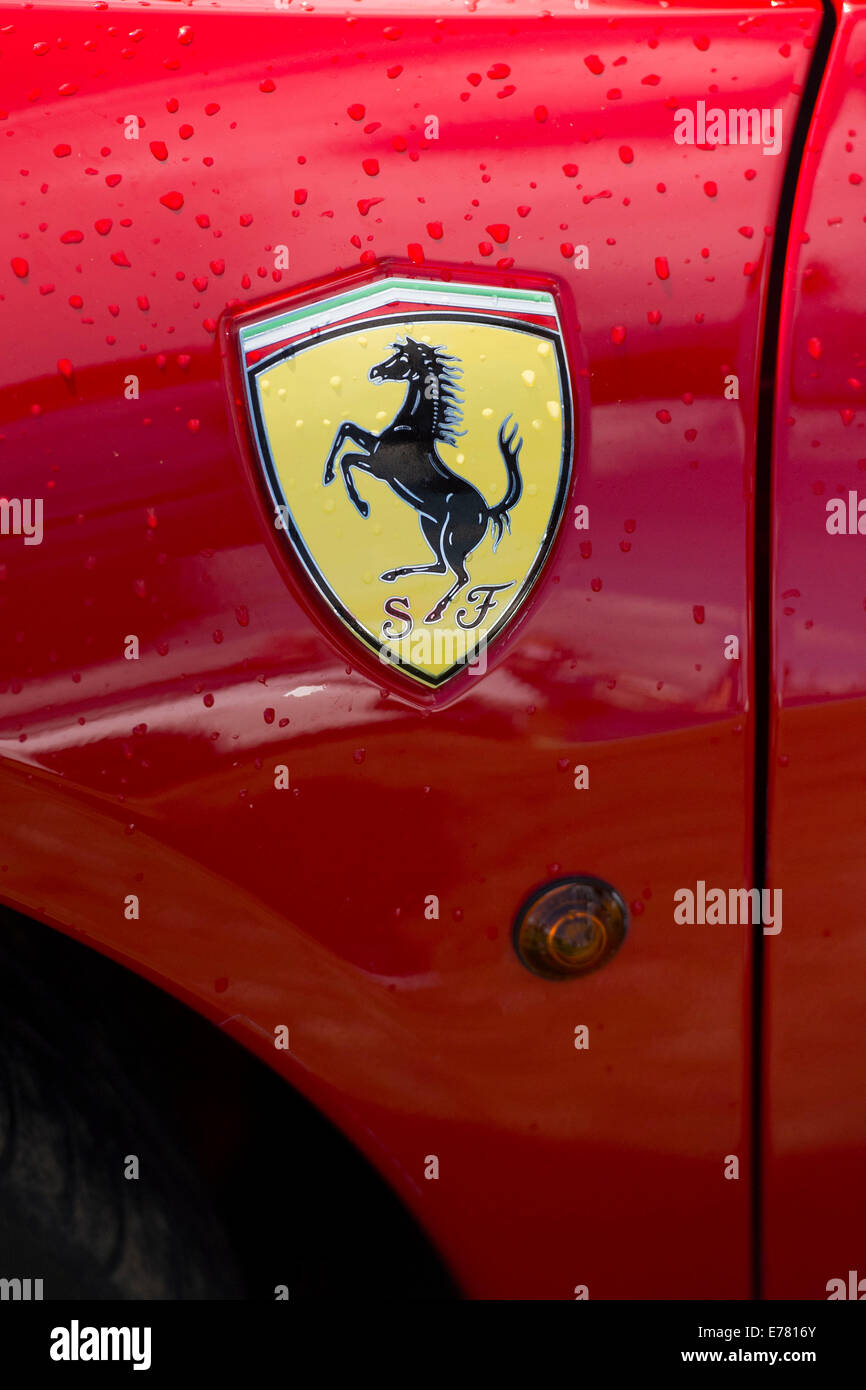 Ferrari logo on side of red Ferrari car. Stock Photo