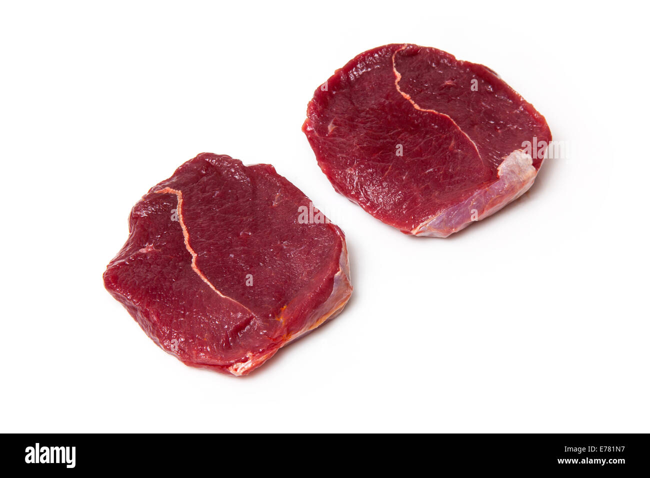 Raw Zebra steaks isolated on a white studio background Stock Photo Alamy