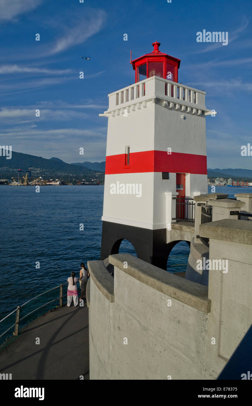 Brockton Point lighthouse in Stanley Park, Vancouver, Canada. North Shore mountains and Burrard Inlet. Stock Photo