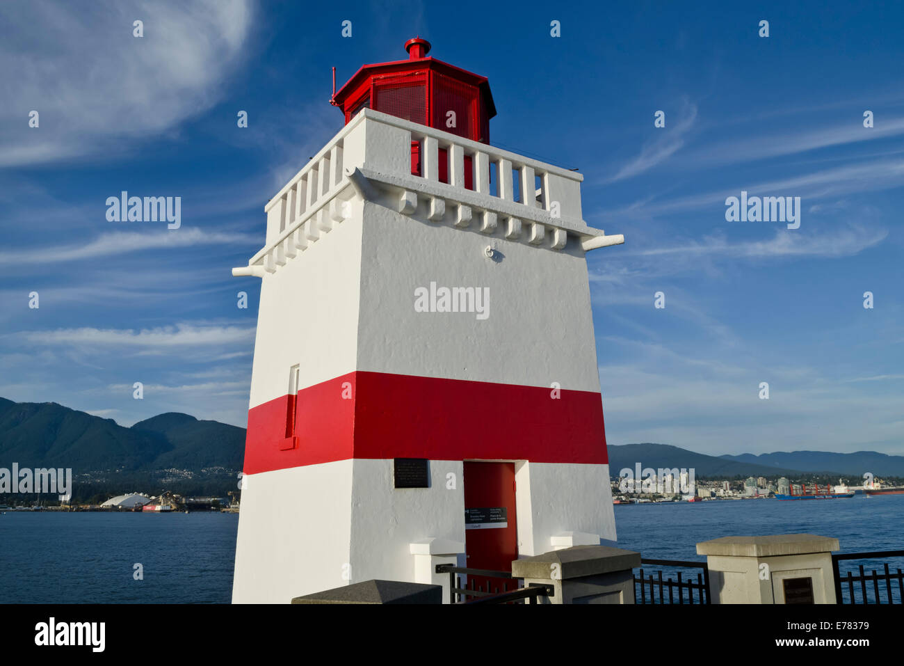 Brockton Point lighthouse on the seawall in Stanley Park, Vancouver, Canada.  Red and white lightstation on Burrard Inlet. Stock Photo