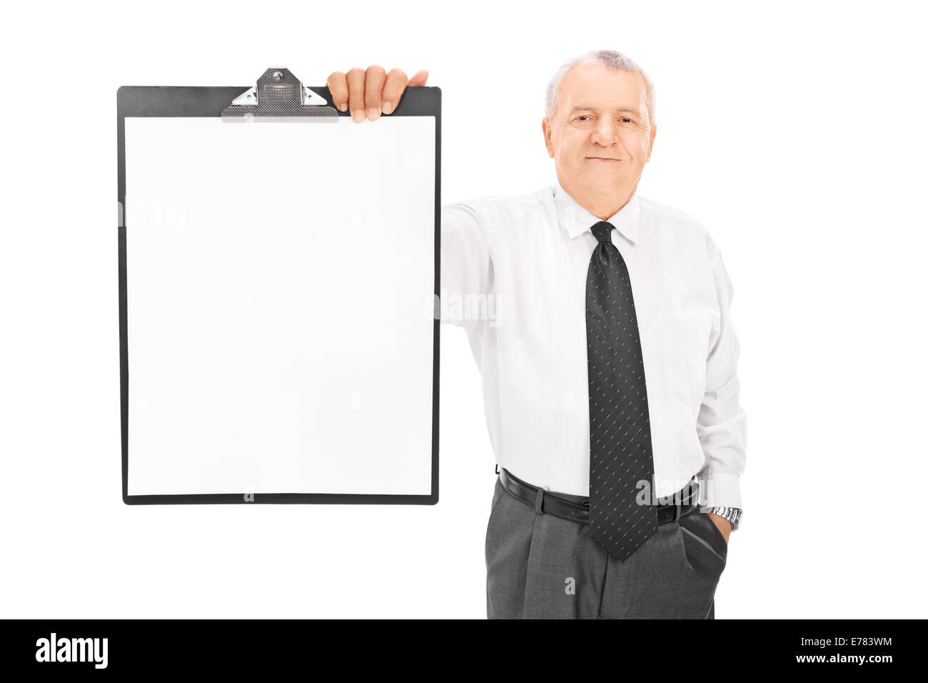 Mature businessman holding blank paper on clipboard isolated on white ...