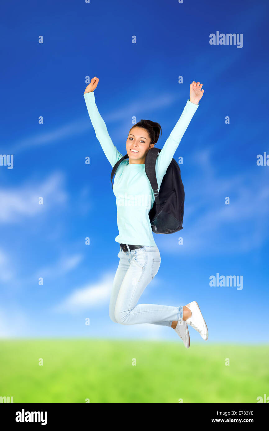 Young Girl Jumping with a blue sky background Stock Photo - Alamy