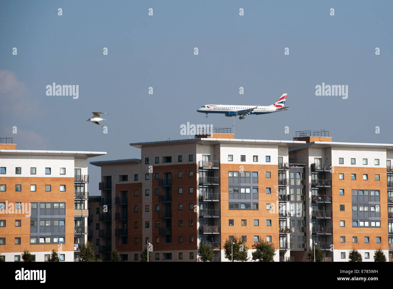 A plane landing at City Airport in East London flies over some
