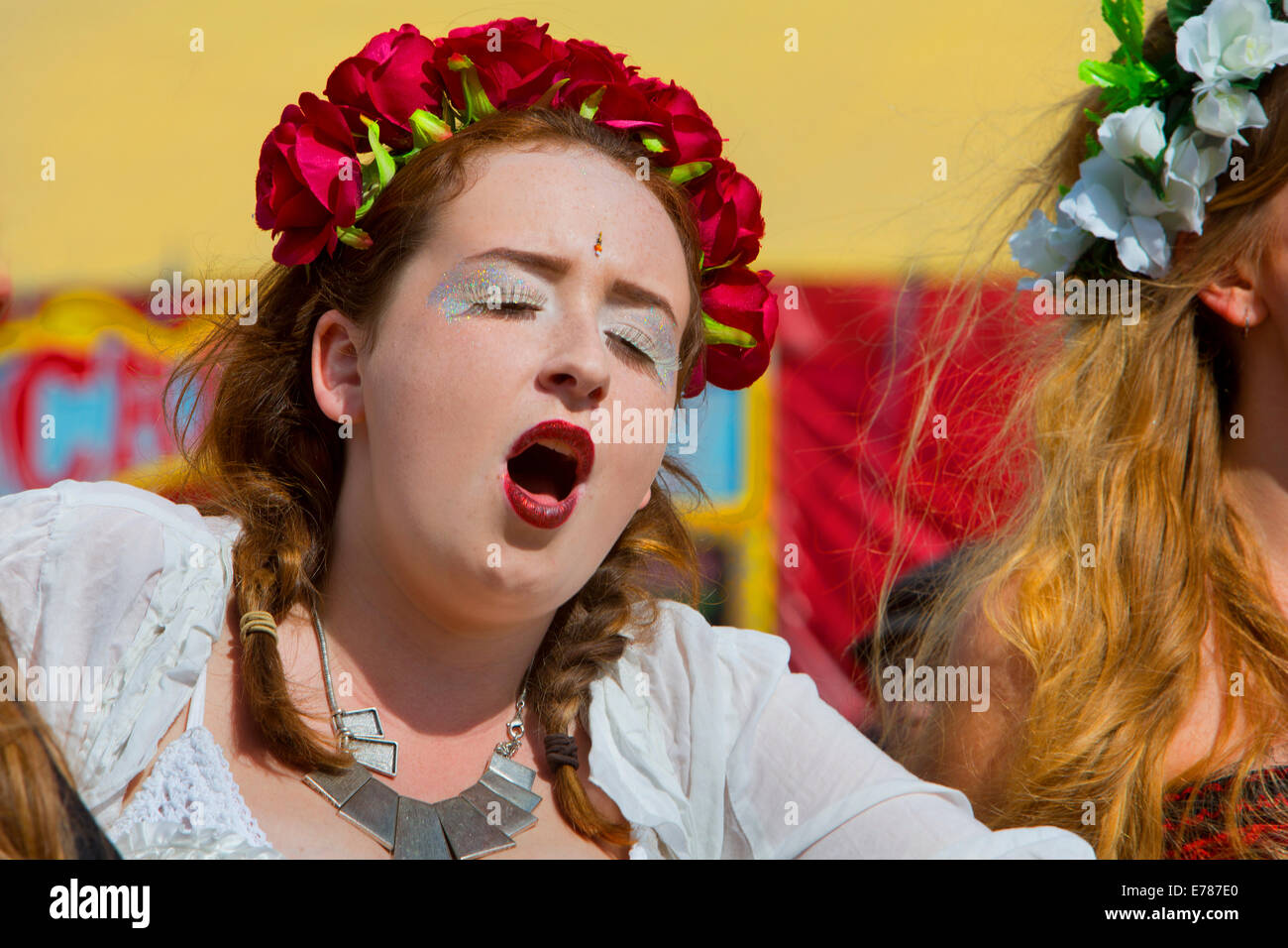 Girls singing in the Glastonbury Festival 2014 Stock Photo