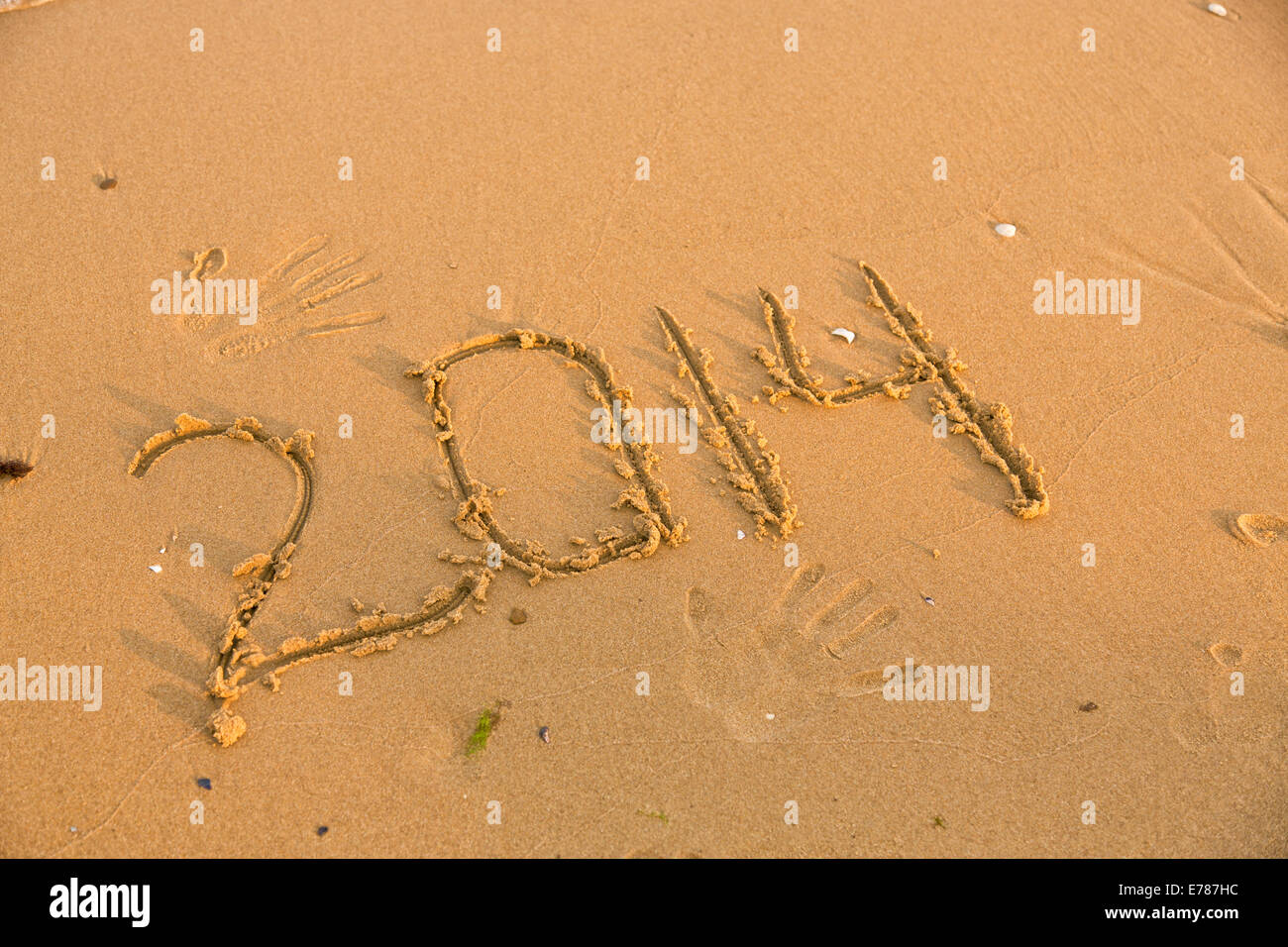 2014 numbers on the yellow sandy beach, text Stock Photo - Alamy