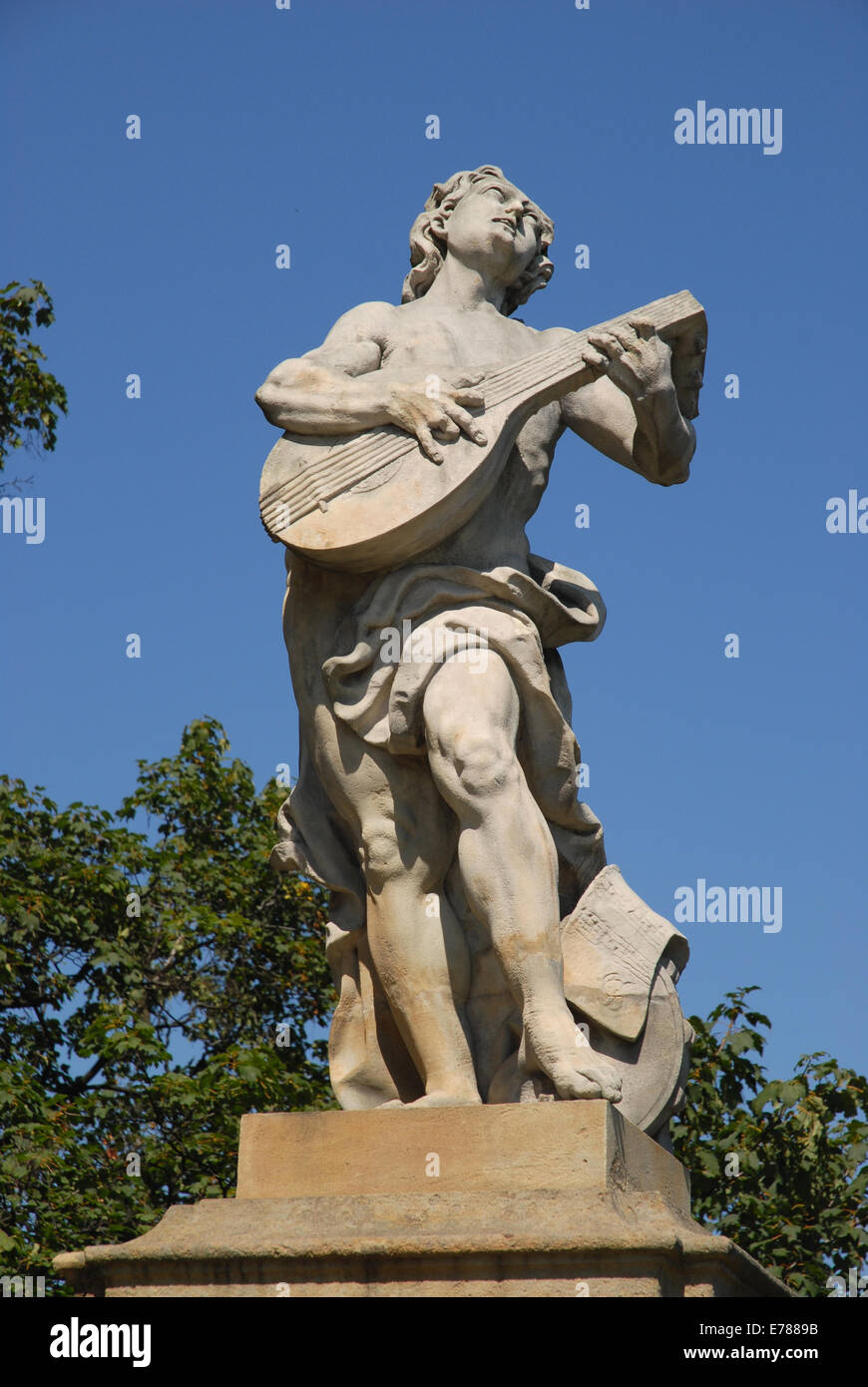 a statue of a musician in the garden of Ksiaz Castle, Walbrzych, Lower Silesia, Poland Stock Photo