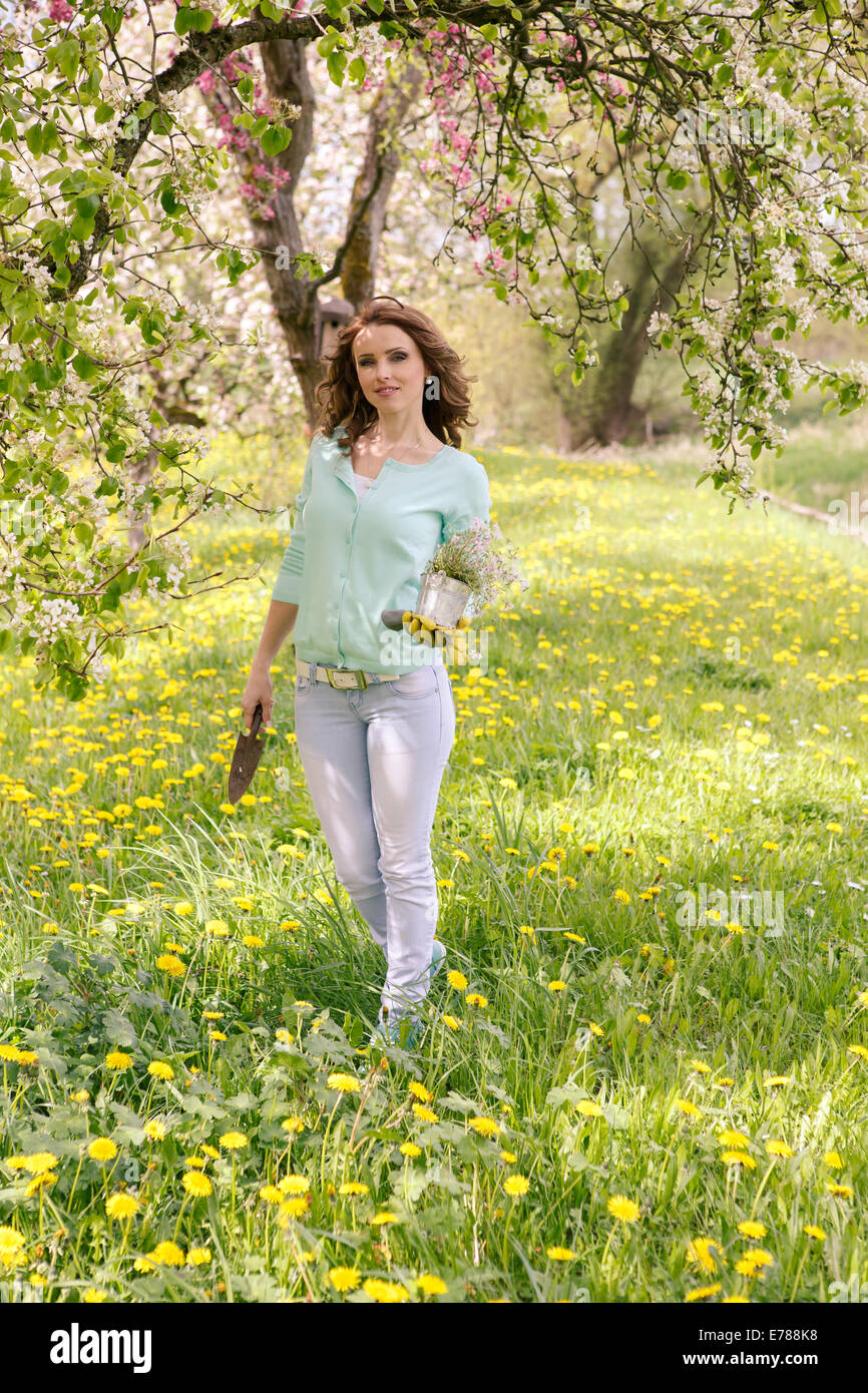 Woman in her garden hi-res stock photography and images - Alamy