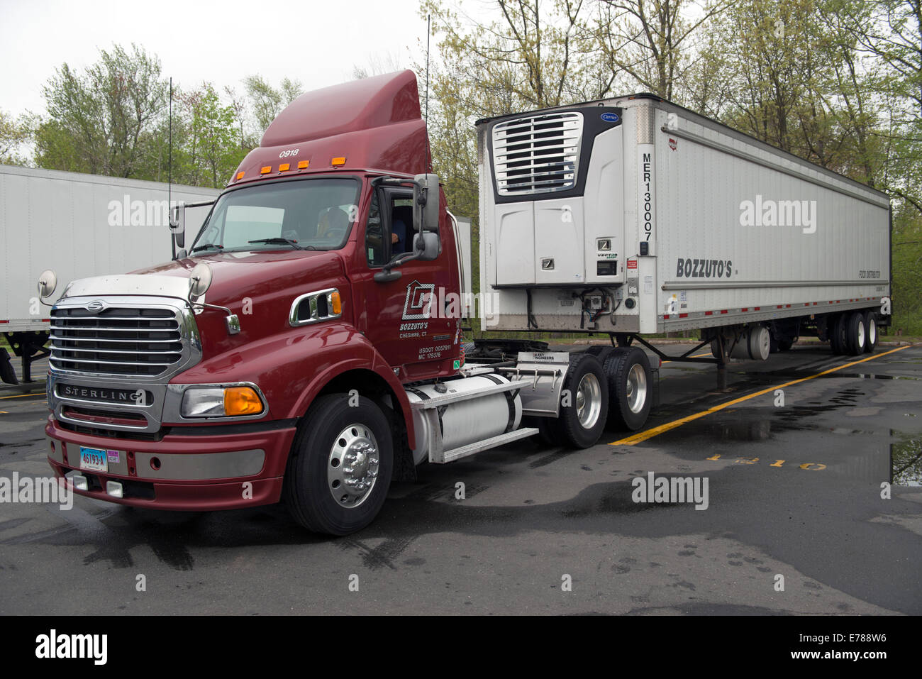 Tractor truck backing up to hook up trailer  at Bozzuto's Distribution center. Stock Photo