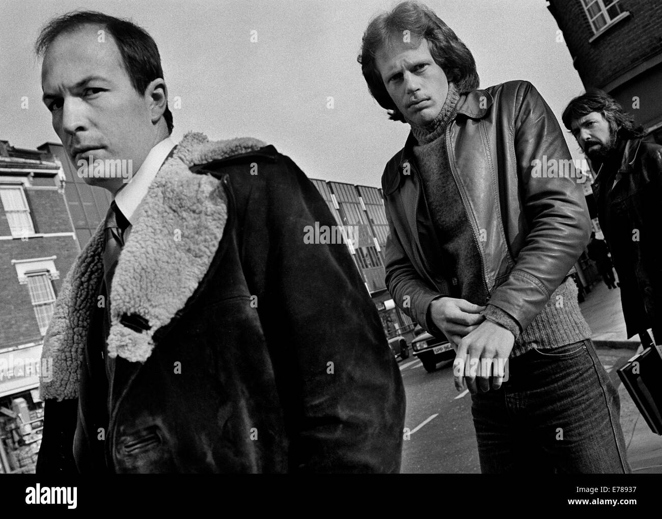 Waiting for the morning bus, Crouch End Broadway. Leather jackets and sheepskin coats were very popular in a time before the exp Stock Photo