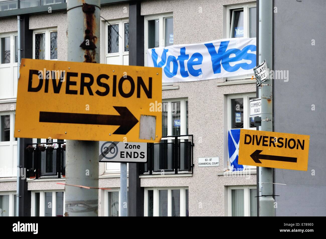 Glasgow, Scotland, September 9, 2014. Flags and banners on a window in Glasgow's Gorbals proclaim support for a 'Yes' vote as the Scottish independence referendum approaches. Voting on whether Scotland should be an independent country will take place on September 18th, 2014 Credit:  Tony Clerkson/Alamy Live News Stock Photo