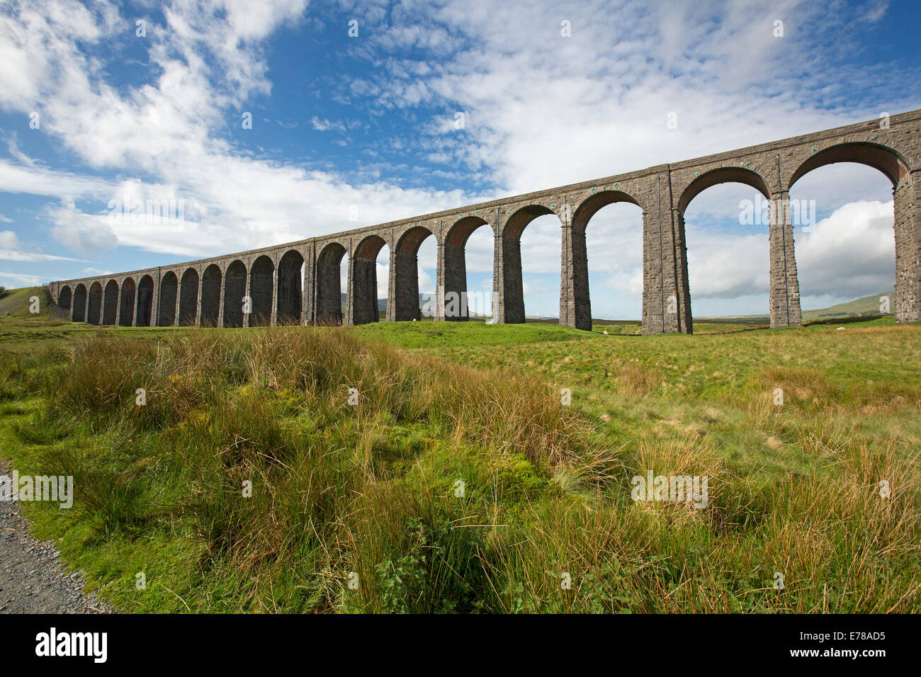Ribblehead viaduct, massive 19th century British rail bridge crossing Ribble Valley and under blue sky in North Yorkshire England Stock Photo