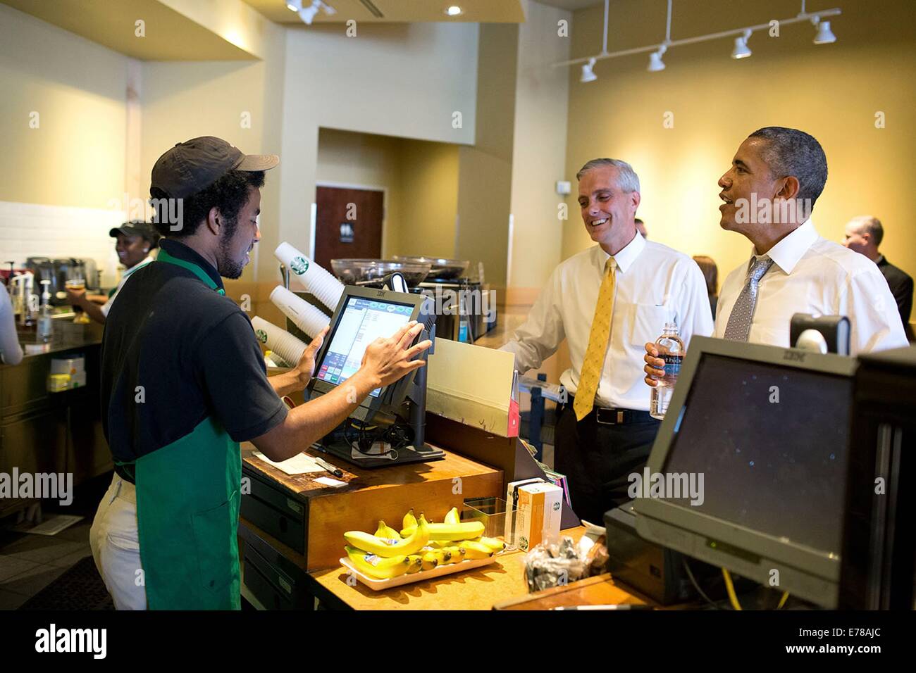 US President Barack Obama and Chief of Staff Denis McDonough place an order at Starbucks June 9, 2014 in Washington, DC. Stock Photo