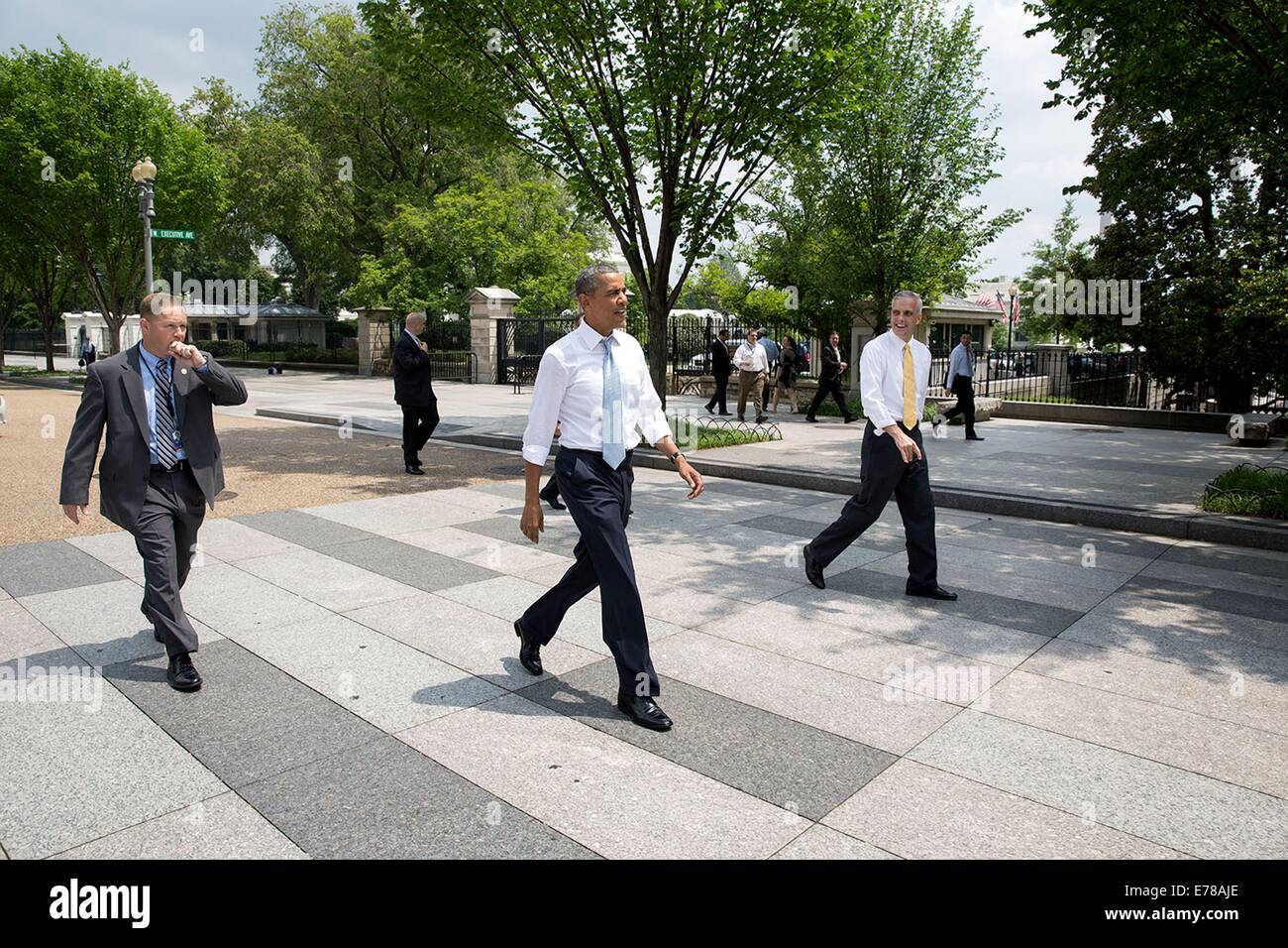 US President Barack Obama walks on Pennsylvania Avenue with Chief of Staff Denis McDonough on their way to Starbucks June 9, 2014 in Washington, DC. Stock Photo