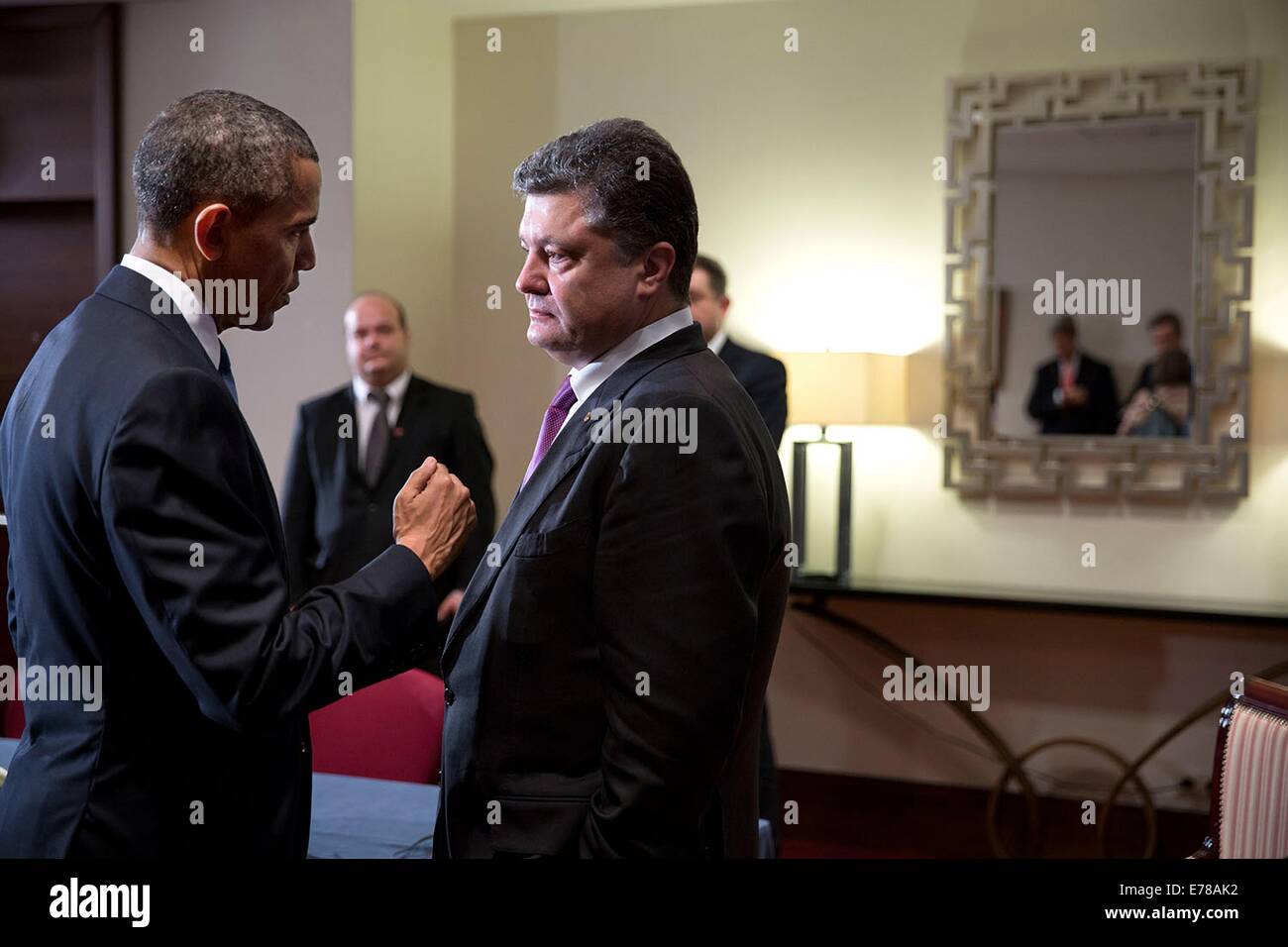 US President Barack Obama talks with President-elect Petro Poroshenko of Ukraine after statements to the press following their meeting at the Warsaw Marriott Hotel June 4, 2014 in Warsaw, Poland. Stock Photo