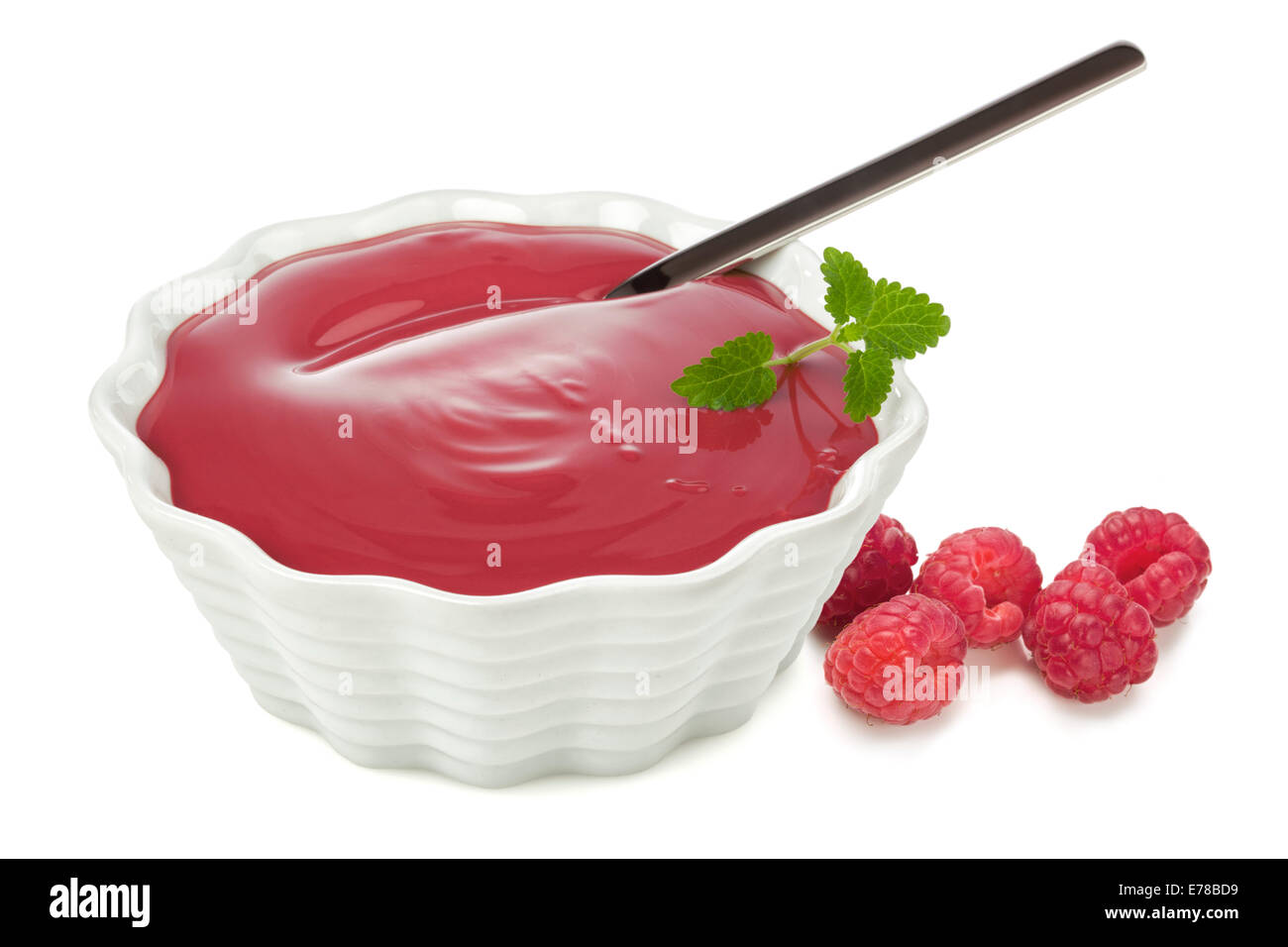 Raspberry fruit dessert in bowl with spoon Stock Photo