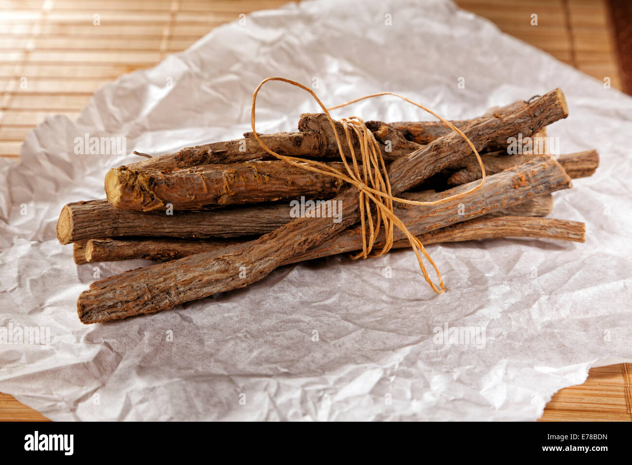 Bundle of licorice roots on wrapping paper Stock Photo Alamy