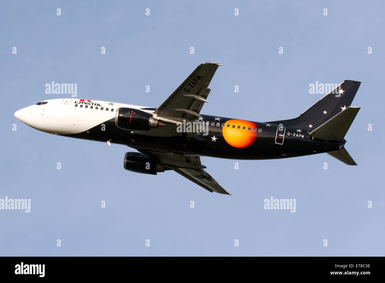 Titan Airways Boeing 737-300 climbs away from runway 23L at Manchester airport. Stock Photo