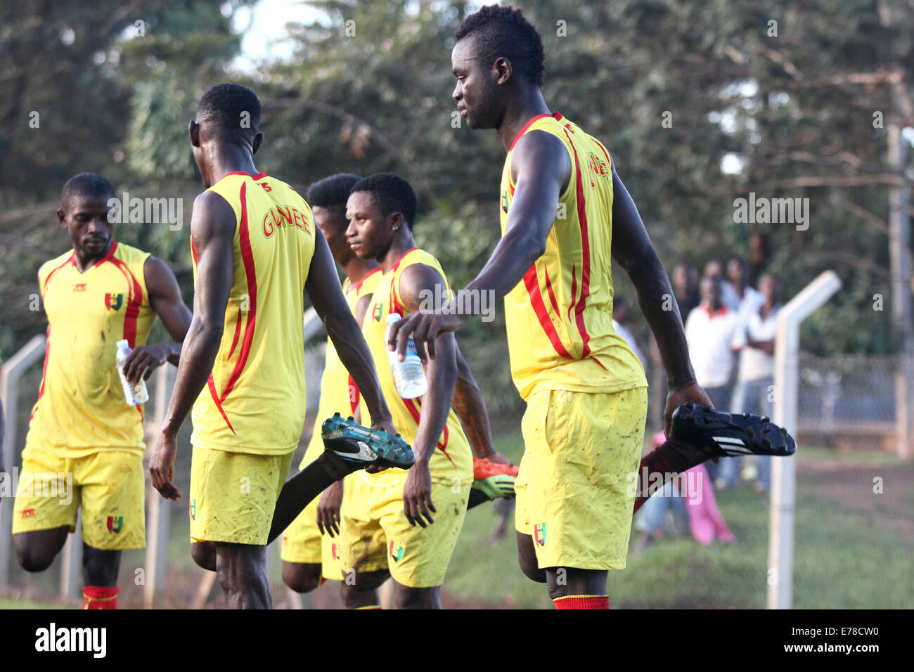 Kampala, Uganda. 8th September, 2014. Some of the Guinea national football team players pictured warming up in Kampala as they prepare to take on hosts Uganda Cranes in an Africa Cup of Nations qualifier on Wednesday September 10th, 2014. Despite the threat of Ebola outbreak, Uganda is to host Guinea in the Africa Cup of Nations soccer qualifier. The disease has so far killed 2,100 people in the West African countries of Guinea, Liberia, Sierra Leone and Nigeria, according to the World Health Organization. Credit:  Samson Opus/Alamy Live News Stock Photo