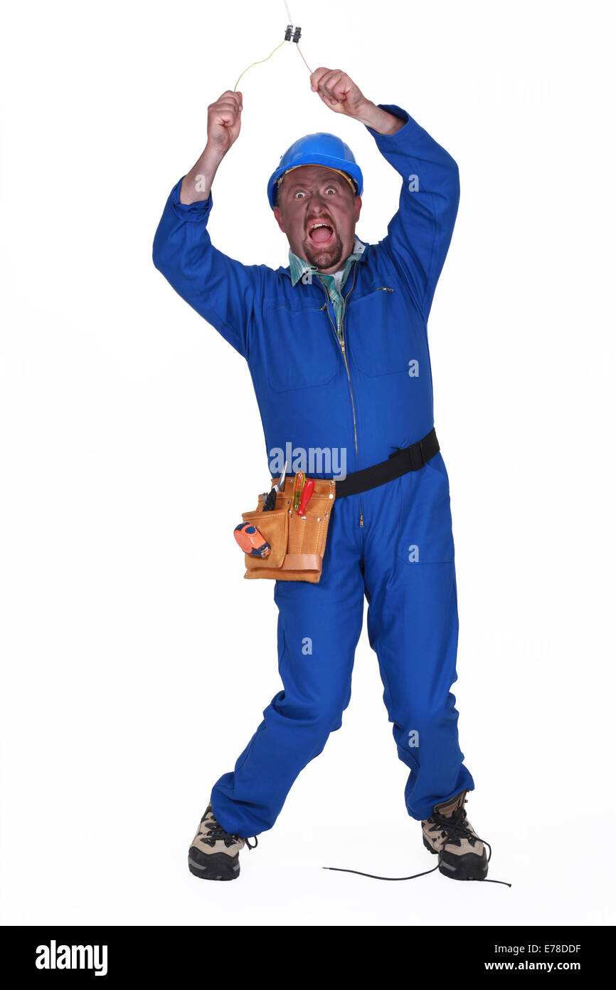 Electrician getting a shock from a light socket Stock Photo Alamy
