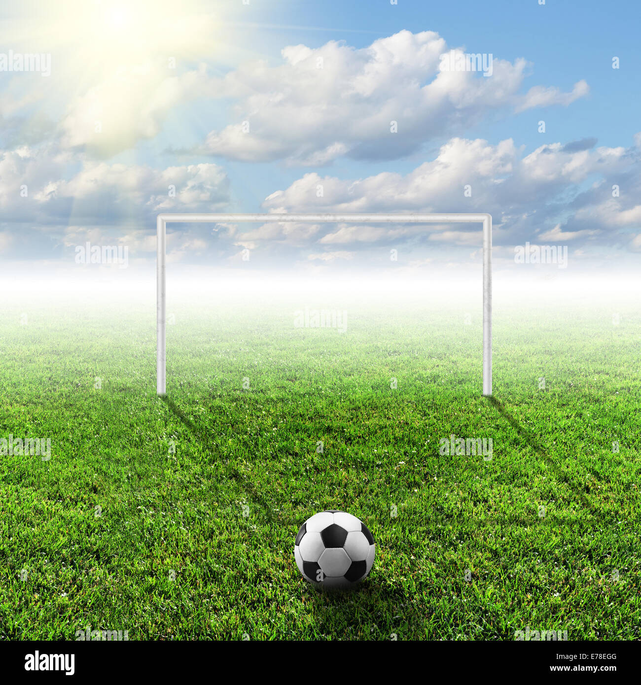 football field with ball in a bright sunny day Stock Photo